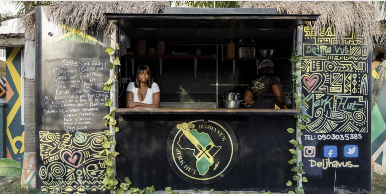 Deijha Gordon, 33, poses for a photograph in her food truck in Accra, Ghana, Wednesday, Dec. 11, 2024. Deijha, who relocated from New York, has obtained Ghanaian citizenship. (AP Photo/Misper Apawu)